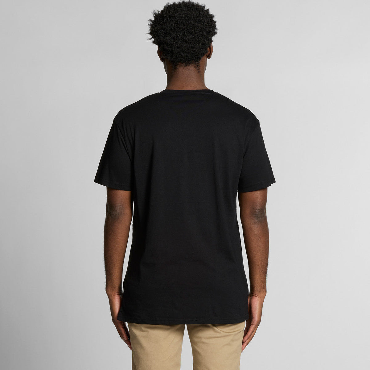 Black crew neck t-shirt with short sleeves and a relaxed fit.