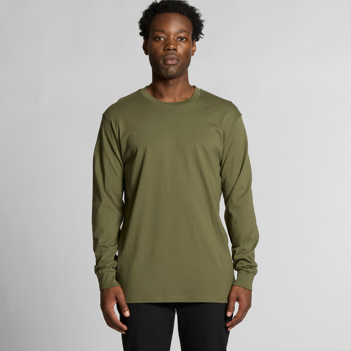 Olive green long-sleeved crew neck t-shirt with pocket detail, made of cotton and polyester blend.