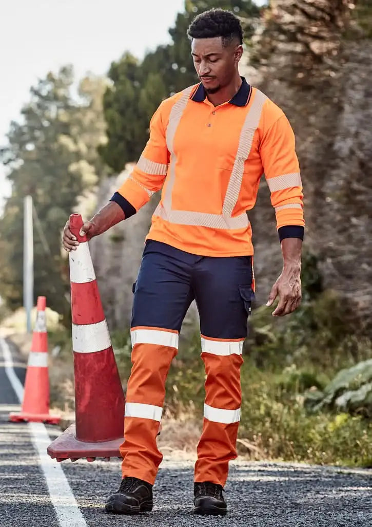 Man in Syzmik Men’s Bio Taped Pant ZP980 high-vis workwear, stay visible on site