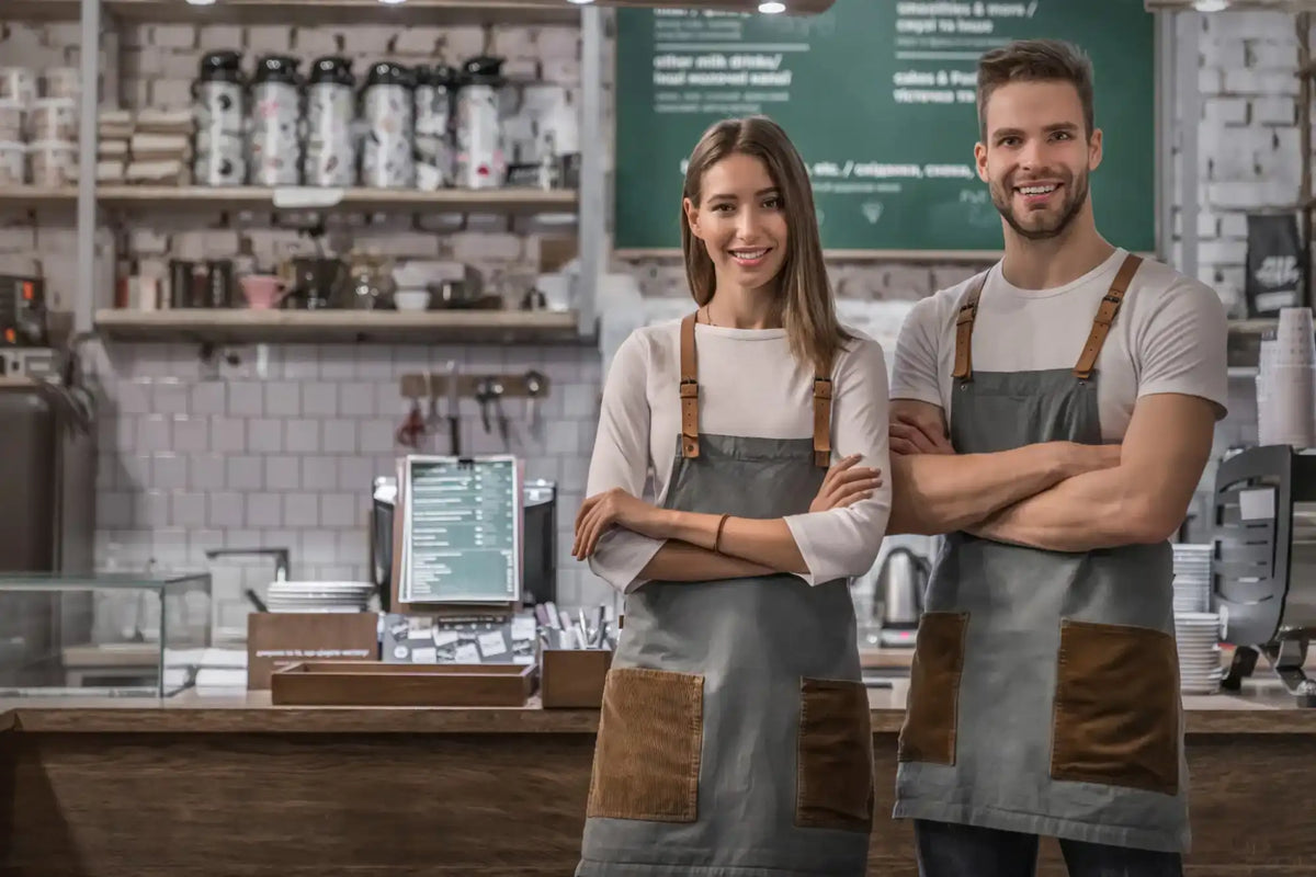 Smiling cafe owners.