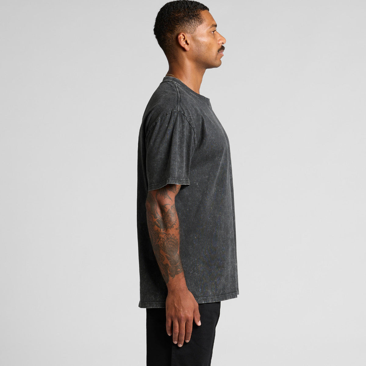 Charcoal distressed oversized t-shirt with a relaxed fit and raw hem.